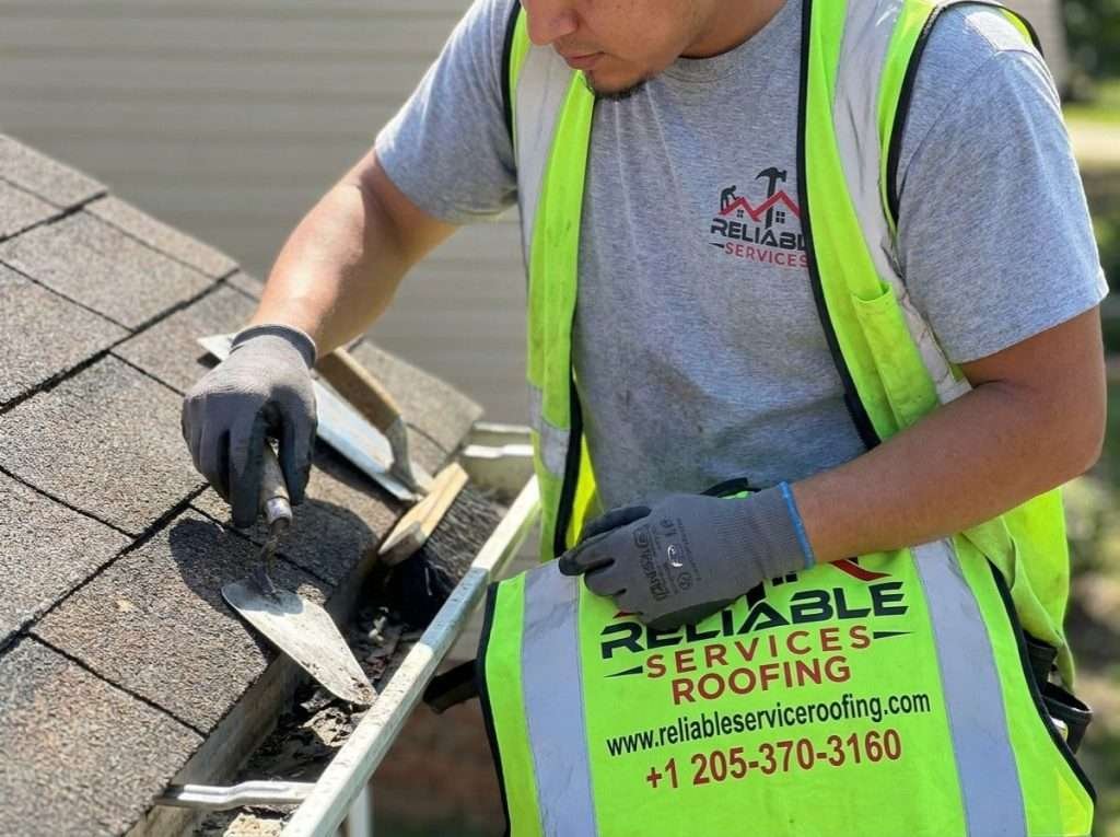 Roofing contractors inspecting and cleaning a roof for maintenance in Nashville, TN – professional roof maintenance contractors